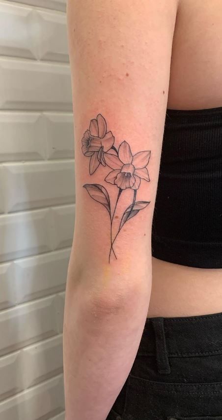 Daffodil Dog Tattoo, Easter Flower Tattoo, Daffodil And Lilac Tattoo, Daffodil Bunch Tattoo, Blue Daffodil Tattoo, Daphodile Flower Tattoo, Daffodil Tattoo Leg, Purple Daffodil Tattoo, Daffodil Tattoo Bouquet