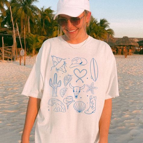 Beachy vibes all around with this coastal cowgirl tshirt! Blue Coastal Cowgirl, Coastal Elegance, Coastal Lifestyle, Cowgirl Shirts, Coastal Cowgirl, Western Cowgirls, Comfort Colors Shirt, Western Cowgirl, Beach Shirts