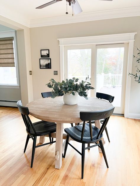 Black Table Breakfast Nook, Modern Rustic Breakfast Table, Neutral Breakfast Nook, Breakfast Nook Dining Tables, Modern Farmhouse Round Dining Room Table, Black And White Breakfast Nook, Circle Table In Kitchen, Circle Table Aesthetic, Black Small Dining Table