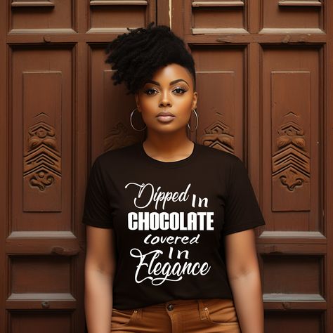 Title: "Empowerment T-shirt - Dipped in Chocolate, Covered in Elegance | Women's Self-Love Apparel" Description: Our T-shirts are crafted from the highest quality, super-soft cotton for ultimate comfort and durability. Featuring an exclusive design, the "Dipped in Chocolate, Covered in Elegance" tee embodies grace, strength, and undeniable confidence. This made-to-order shirt brings together style and purpose--because we believe in empowering women to express their inner beauty and strength. Design Details: Front:  Dipped in Chocolate, Covered in Elegance"--a powerful statement for women who embrace their individuality and grace.  Back: Blank  ---------------------------------------------------------------------------------------------------------------------------------------------------- Dipped In Chocolate, Queen Tshirt, Stil Inspiration, Empowering Women, Statement Shirt, Confident Woman, Inner Beauty, Everyday Wardrobe, Our Lady