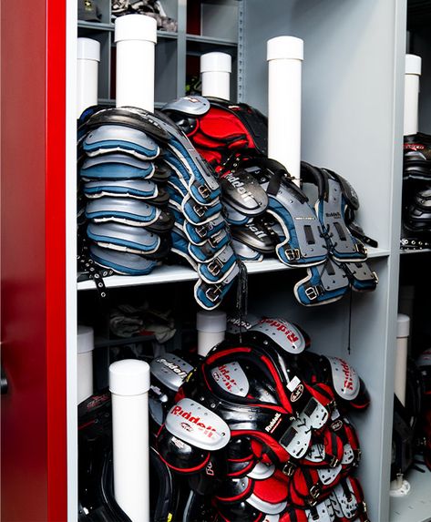 “Aurora custom-designed a solution for our football shoulder pads, re-purposed their golf bag storage to organize our hockey sticks, and even used our school colors. In the end, Aurora helped us accomplish our storage needs and organize the spaces in a way that we can be proud to show off what’s typically behind closed doors,” said Campus Recreation Director, Steven Stocker. Football Equipment Storage Ideas, Football Equipment Storage, Football Storage, Athletic Storage, Football Shoulder Pad, Golf Bag Storage, Equipment Room, Football Shoulder Pads, Football Pads