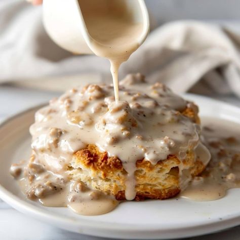 Southern-style biscuits and gravy is such a treat! The savory, creamy sausage gravy is poured over tender biscuits for a breakfast to remember. Biscuits And Gravy Aesthetics, Applejack Aesthetic, Southern Biscuits And Gravy, Easy Biscuits And Gravy, Biscuit And Gravy, Country Biscuits, Homemade Gravy For Biscuits, Sausage Biscuits, Southern Breakfast