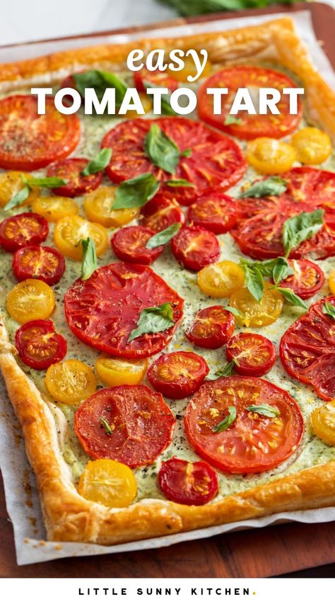 This easy and beautiful Tomato Tart is topped with herbed ricotta cheese and juicy tomatoes. Made with puff pastry, it's ready in under 40 minutes. Ina Garden Tomato Tart, Tomato Pie Puff Pastry, Heirloom Tomato Puff Pastry, Tomato Pie Crescent Rolls, Tomato Ricotta Puff Pastry Tart, Tomato Tart Puff Pastry Feta, Tomato Tart With Ricotta, Puffed Pastry Tomato Tart, Tomato Feta Puff Pastry