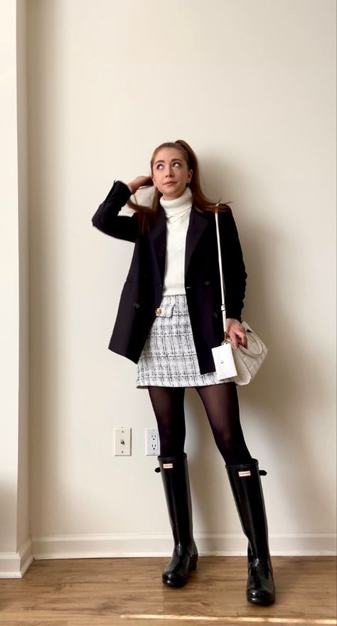 Black & White Preppy Fall Outfit (Blair Waldorf Inspired) featuring a black & white tweed plaid skirt, black tights, white turtleneck sweater, black coat, white purse, and black rainboots. All outfit details are in the link on my @shopLTK profile. White Turtle Neck And Skirt Outfit, White Turtleneck Skirt Outfit, Blazer Preppy Outfit, White Turtleneck And Skirt Outfit, Black Tights White Boots, Black And White Tweed Skirt Outfit, Black And White Preppy Outfits, Tweed Shorts Outfit Winter, Black Rainboots Outfit