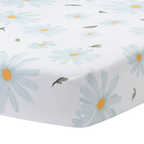 PRICES MAY VARY. Breathable 100% cotton fitted crib sheet Pretty tossed daisies on a soft white ground with falling leaves Elastic all the way around ensuring a safe and secure fit on a standard size crib mattress measuring 28” X 52” Machine washable and dryable for easy care Coordinates beautifully with Lambs & Ivy’s Sweet Daisy Collection This breathable 100% cotton fitted crib sheet is a charming print of tossed daisies on a clean white ground. The daisies are various sizes, are a beautiful s Bee Nursery, Lambs & Ivy, Baby Crib Bedding Sets, Baby Crib Bedding, Blue Nursery, Baby Bedding Sets, Baby Fits, Elephant Plush, Crib Bedding Sets