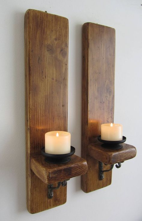 Pair of rustic wall sconces with removable black metal candle holders. Made from reclaimed 32mm thick planks with decorative cast iron brackets. Finished in antique brown beeswax. Suitable for holding candles up to 3 inches thick (not supplied). Available in various lengths , please Plank Wood Wall, Cast Iron Brackets, Rustic Wall Lighting, Iron Brackets, Shop Space, Rustic Wall Sconces, Plank Walls, Rustic Candle Holders, Diy Candle Holders