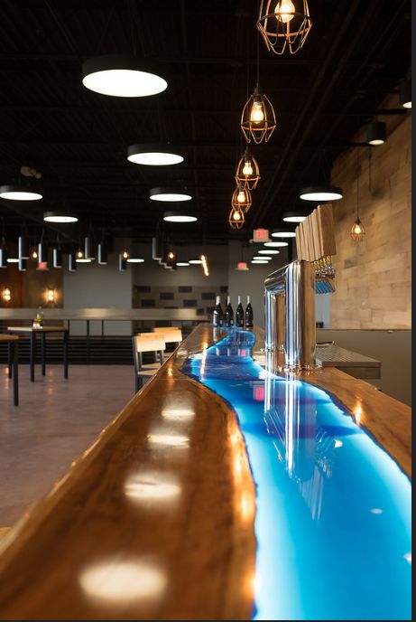 Eutree Forest Free cherry artisan wood slab bar top at Sweetwater Brewery. River bar top finished by Subeau Design & Build. Commercial Bar Top Ideas, Epoxy Bar Top Ideas, Wall Wood Paneling, Epoxy Bar Top, Bar Top Ideas, White Oak Wall, Bar Top Epoxy, Mulberry House, Bar Lounge Design