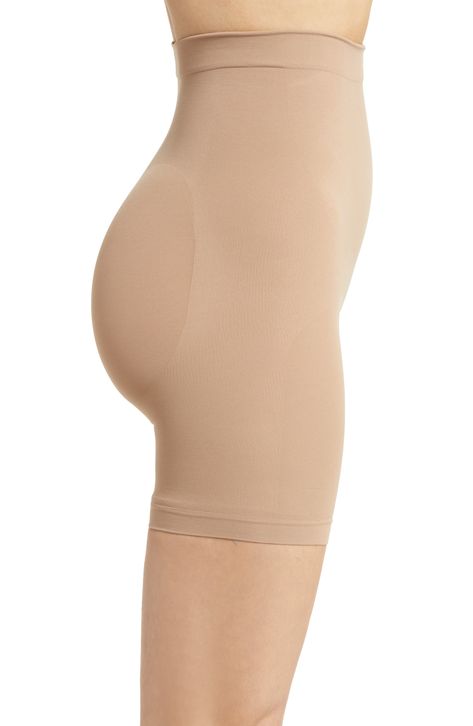 Sculpt your body's natural shape with shaping shorts that hit just above the knee with a whisper-soft and seamless design from Kim Kardashian's SKIMS. Reflecting the brand's passion for highly technical shapewear solutions for every body, this staple piece smoothes your upper legs while lifting your butt and comes in different shades to complement your skin tone. 5" regular inseam Cotton-lined gusset 82% nylon, 18% elastane Machine wash, tumble dry Made in Turkey Beige Smoothing Shapewear Mid-thigh Length, Beige Shapewear Smoothing Shorts, Beige Smoothing Shapewear Shorts, Beige Shapewear Shorts With Smoothing, Smoothing Shapewear Above Knee, Smoothing Above-knee Shapewear, Beige Seamless Mid-thigh Shapewear, Shapewear Smoothing Shorts Above Knee, Compressive Mid-thigh Length Shapewear With Soft Touch