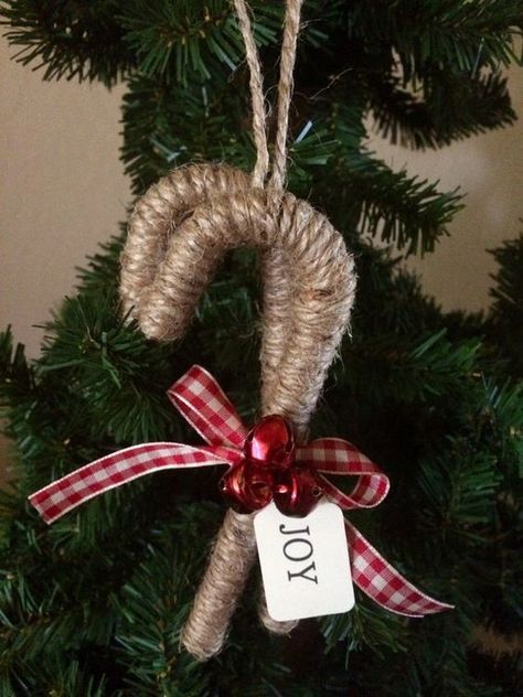 a cozy rustic Christmas ornament a twine wrapped candy cane with red bells and a plaid bow is a lovely idea Christmas Candy Cane Decorations, Christmas Symbols, Candy Cane Crafts, Cheap Farmhouse, Rustic Christmas Ornaments, Handmade Christmas Crafts, Candy Cane Christmas, Porch Christmas, Farmhouse Front