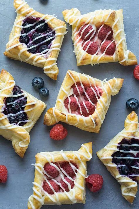 There are so many different textures going on in these pastries: buttery, flaky layers that are so light and airy with crispy, crunchy edges. Tart, juicy berries nestled in a rich, creamy, sweet filling. Each bite is delightful! Resep Puff Pastry, Cherry Danish, Cream Cheese Puffs, Puff Pastry Recipes Dessert, Cream Cheese Puff Pastry, Bakery Breakfast, Puff Pastry Cream Puffs, Pastries Recipes Dessert, Danish Recipe