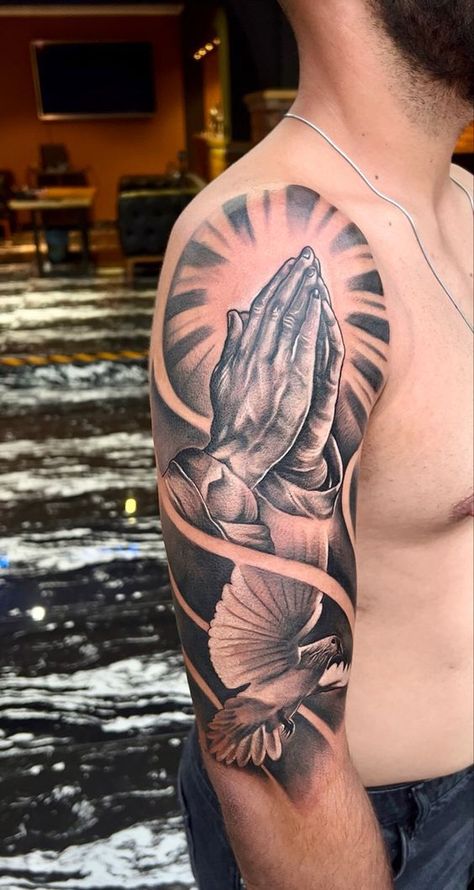 If you have been looking for unusual tattoo designs with praying hands for a long time, then our article is for you. We have collected 55+ of the most interesting and their meanings in human life. Praying Hands Half Sleeve Tattoo, Praying Hands Tattoo Sleeve, Praying Hands Tattoo Shoulder, Half Upper Sleeve Tattoo Men, Upper Hand Tattoo Men, Men’s Upper Arm Tattoos, Upper Arms Tattoo, Prayer Tattoo Men, Jesus Praying Tattoo