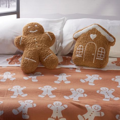 A decorative pillow from our Christmas Collection in the shape of a gingerbread man. The Gingerbread man design features brown and white sherpa material with white ricrac and buttons to create the look and feel of a gingerbread cookie with icing detail. Our Gingerbread Man shaped pillow contains polyester filling and is shipped vacuum-sealed for protection and storage. A fun gingerbread-themed home accent perfect for seasonal use. Cookie With Icing, Gingerbread Pillow, Sherpa Pillow, Gingerbread Man Decorations, Halloween Furniture, Man Pillow, Gingerbread Diy, Spring Rugs, Christmas Products