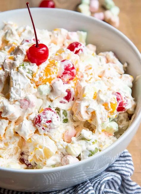 This Ambrosia Salad is a creamy fruit salad that is so easy to make, and so delicious, it's practically dessert. It's a perfect side dish for a summer bbq, holiday dinner, or any day of the year. Easy Ground Beef Meals, Samoa Pie, Macroni Salad, Mango Desert, Ambrosia Salad Recipe, Ambrosia Recipe, Ambrosia Fruit Salad, Creamy Fruit Salads, Jello Salads