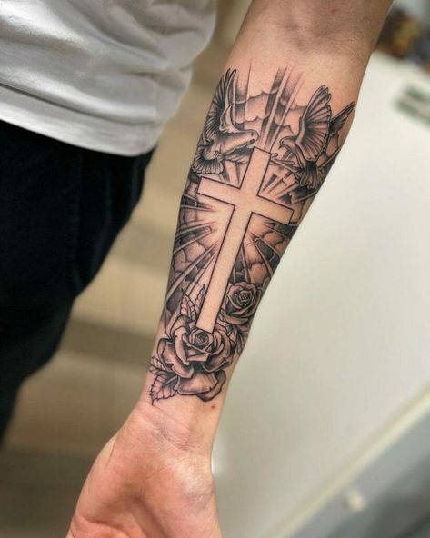 Cross tattoo photo Cross Arm Sleeve Tattoo, Cross With Background Tattoo, Cross With Lightning Tattoo, Tattoo Forearm Sleeve Men, For Arms Tattoo Men, Biblical Chest Tattoos For Men, Tattoo Ideas For Men Forearm Small, Male Cross Tattoos, Country Tattoo Ideas For Men