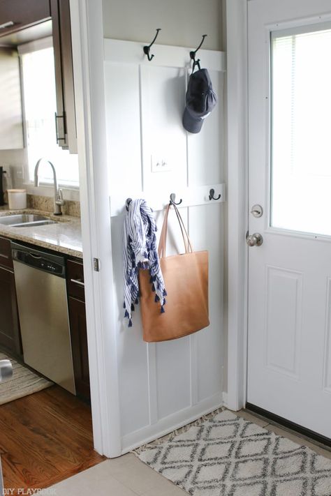 The back door entryway is just as functional as the front! Hooks abound for jackets, purses, scarves and hats. Batten Board, Creating An Entryway, Laundry Room Ideas Small Space, Entryway Hooks, Room Storage Diy, Diy Playbook, Small Entryways, Door Entryway, Drop Zone