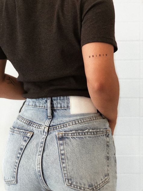 Small Women Tattoos Arm, Date Tattoo On Back Of Arm, Date Tattoo Above Elbow, Small Behind Arm Tattoo, Script Tattoo Above Elbow, Delicate Date Tattoo, Tattoos Around The Elbow, Small Initial Tattoo Placement, Small Back Arm Tattoos For Women