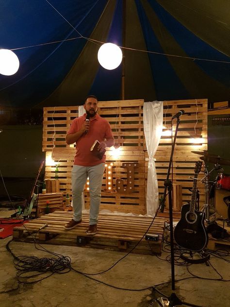 Worship outdoors Diy Outdoor Stage Ideas, Outdoor Worship Night, Pallet Stage Platform, Backyard Stage For Band, Outdoor Karaoke Party Ideas, Diy Outdoor Stage, Diy Stage Platform, How To Decorate A Garage For A Party, Outdoor Stage Ideas