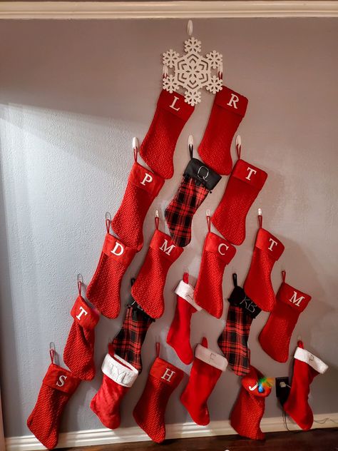 Christmas Stocking Wall Decor, Large Family Stocking Hanging Ideas, Christmas Stocking On Wall, Alternative Christmas Stocking Ideas, Hanging Christmas Stockings On Wall, Creative Ways To Hang Stockings On Wall, Stocking Display Ideas, Stocking Wall Ideas, How To Decorate Stockings For Christmas