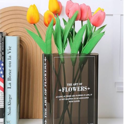 Book Lovers Gifts!! The beautiful vase is designed with the shape and texture of a book, subtly blending cultural art and modern aesthetics, making it easy to fit into any decor space. Perfect for book lovers!

#booktok #flower #decor #homeoffice #bookshelf #books #bookaesthetic #interiordesign #backlist #officegifts #officedesign #desktrinkets #bookends #organization #giftsforher #giftsforwife #giftsforgirlfriend #cutegifts #cheapgifts #bridalshower #weddinggifts #homewarminggifts #housewarming Book About Flowers, Cute Bookshelf, Acrylic Flower Vase, Cute Bookshelves, Vase Cute, Flowers Black, Black Vase, Unique Vases, Gift Box Packaging