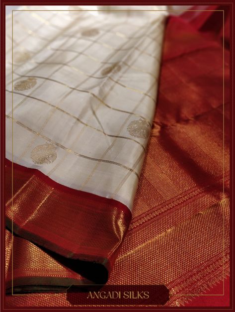 Yet another beautiful piece from the ‘Venpattu” collection is the off-white Bridal Kanjivaram Saree at Angadi Silks. This saree combines the subtle elegance of gold “Kattam” (Checks) on the body with “Gandaperunda” Motif. #sarees #whatiwore #sarilove #handlooms #kanjivaramsilksaree #weddingsaree #AngadiSilks #Angadi #TheHouseOfAngadi #Bangalore #Bridalwear #wedding Off White Pattu Saree, White Pattu Saree Indian Weddings, White Silk Saree Bridal, Angadi Silk Sarees, White Kanjeevaram Saree, Muhurtham Saree, Indian Ornaments, Saree Color Combinations, Off White Saree