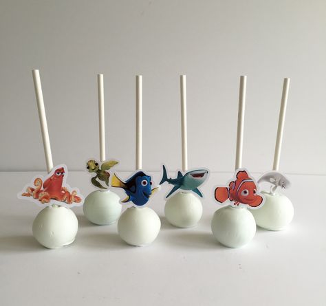 Finding Dory cake pops Nemo Cake Pops, Dory Cupcakes, Finding Dory Cupcakes, Ocean Birthday Theme, Finding Dory Cake, Dory Cake, Nemo Cake, Ocean Birthday, Pop Cans