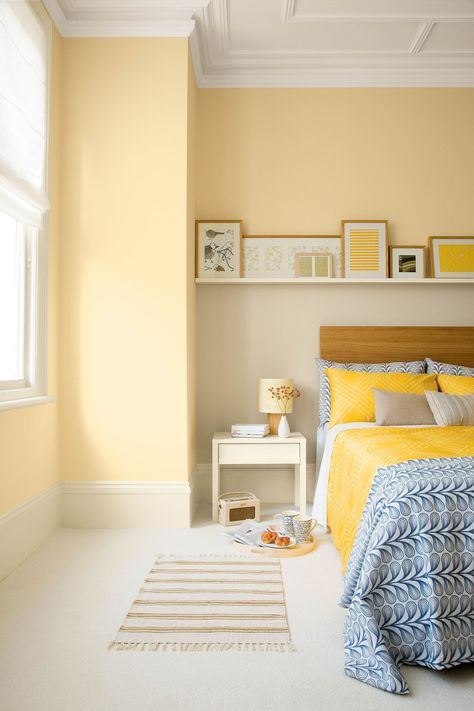 Tap into lighter shades of softer yellow if you're after something more muted. It will refresh your space while also appearing to make your bedroom feel much bigger. Top tip: add in some brighter yellow accessories to accentuate the space. (Photo: Crown) #bedroomideas #bedroomdecor #bedroomdecoratingideas #yellowgold Bedroom With Yellow Walls, Yellow Bedroom Paint, Yellow Bedroom Walls, Yellow Bedroom Decor, Yellow Bedding, Yellow Room, Yellow Bedroom, Bilik Tidur, Room Paint Colors