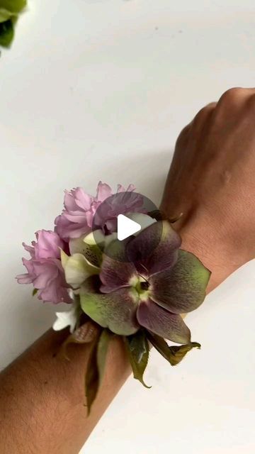 Wollam Gardens on Instagram: "@tint.floral using bits and bobs on our farm to make a DIY cuff style wrist corsage. A perfect homemade gift for mom that honors the beauty of Earth🌍  #floralstyling #flowersofinstagram #underthefloralspell #floraldesign #localflowers #hellebores #flowertips #farmerflorist #wristcorsage #earthday" Make Corsage Wrist, Homemade Corsage Wrist, How To Make A Wrist Corsage, How To Make A Corsage Wristlet, How To Make A Corsage, Diy Corsage Wristlet, Homemade Gift For Mom, Prom Corsage Diy, Corsage Wedding Mother