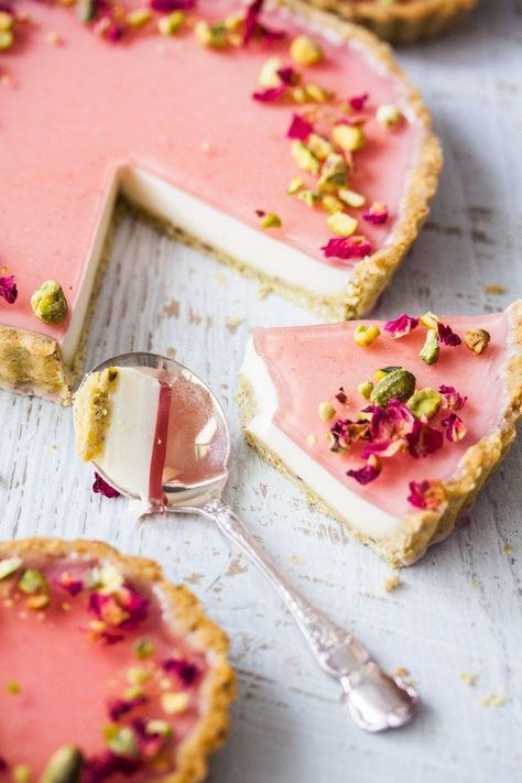 Pistachio Rose Panna Cotta Tart, with it’s pistachio tart crust, rose panna cotta filling and rose jelly topping is a beautiful tart just perfect for a special occasion. Panna Cotta Tart, Rose Tart, Pistachio Rose, Tart Recipes, Food Cakes, Beautiful Food, Just Desserts, The Table, Pistachio