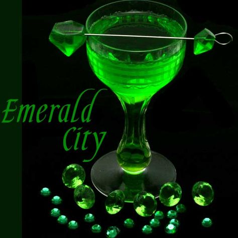 This emerald inspired melon cocktail is a take on the classic margarita with melon liqueur, fresh lime juice, and served with an emerald gemstone gummy. The Emerald City is part of a series of cocktails inspired by gemstones. The emerald is unique among other precious stones in that it is always “flawed”. Emeralds have many … … Continue reading → Wizard Of Oz Drinks, Wizard Of Oz Cocktails, Melon Margarita Recipe, Melon Margarita, Melon Cocktail, Green Cocktails, Emerald Green Cocktail Dress, Emerald Cocktail, Green Melon