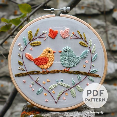 Embroider a sweet pair of lovebirds for Valentine's Day! This easy-to-follow pattern includes full instructions and a PDF download. #valentinesday #handembroidery . #Bird_Hand_Embroidery #Anniversary_Embroidery #Embroidery_Reference #Valentine's_Day_Embroidery Love Bird Embroidery, Bird Hand Embroidery, Embroidery Bird, Bird Embroidery Pattern, Modern Hand Embroidery Patterns, Valentine Embroidery, Birds Embroidery Designs, Embroidered Bird, Embroidery Hand