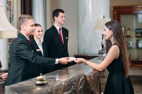 Picture of guests getting key card in hotel, Premium Photo | Premium Photo #Freepik #photo #people #card #woman #man Front Office Hotel, Room Division, Hotel Chef, Hotel Worker, Hotel Photography, Hotel Reception, Office Photo, Hotel Services, Hotel Staff