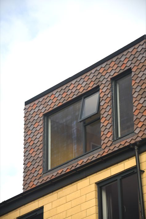 A dormer roof extension featuring vertical arrowhead hanging tiles in a bled of brown heather, bronze and dark heather colours Dormer Roof Extension, Dormer Exterior, Dormer Extension, Loft Extensions, Roof Addition, Loft Dormer, Arrowhead Pattern, Loft Conversion Plans, Loft Extension