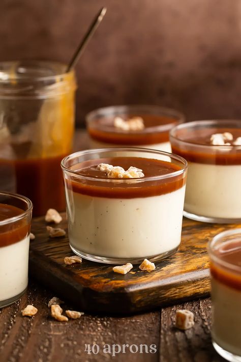 This restaurant -quality creamy panna cotta is spiked with real vanilla bean seeds, all layered with a sinfully rich homemade caramel sauce. 40 Aprons, Vanilla Panna Cotta, Homemade Fried Chicken, Panna Cotta Recipe, Homemade Caramel Sauce, Creamy Desserts, Homemade Caramel, Eat Dessert First, Caramel Sauce