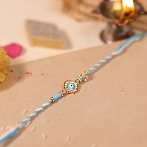 For the brother who’s always got your back, here’s an Evil Eye Rakhi to keep him safe. 💙🧿 . #ProtectiveRakhi #SiblingsForever #EvilEye #EvilEyeRakhi #Rakhi #RakshaBandhan #SiblingLove #Protection #GoodVibes #SpiritualJewelry #HandmadeRakhi #SkyBlue #WhiteAndBlue #EvilEyeBracelet #Jewelry #IndianFestival #Tradition #FestivalFashion #GoodLuckCharm #PositiveVibes #Celebrate #FestivalOfLove #IndianCulture #Blessings #LoveAndProtection #BrothersAndSisters #CulturalTraditions . [Rakshabandha, Rak... Evil Eye Rakhi, Goodluck Charms, Handmade Rakhi, Raksha Bandhan, Got Your Back, Indian Festivals, Spiritual Jewelry, Evil Eye Bracelet, Your Back