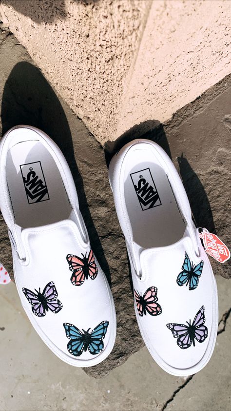 I’ve seen people paint on shoes before so I wanted to give it a try. Ordered a pair of white vans. Painted butterflies on them, using basic acrylic paint I purchased at Michael’s. Once finished, I sprayed them with an anti-stain and water resistant spray that Vans sells. Shoes With Butterflies, Vans Slip On Outfit, Converse 2020, Vans Wallpaper, Aesthetic Converse, Vans Shoes Fashion, Vans Painted, Vans Shoes Women, Custom Vans Shoes