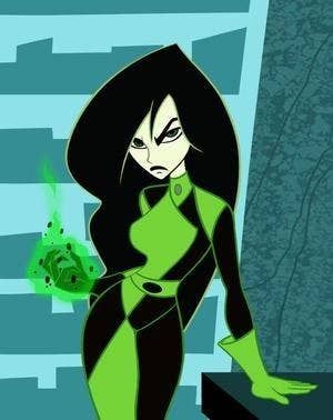 This is Shego and she's a life snatching, fierce, villainous QUEEN! 19 Reasons Why Shego From "Kim Possible" Is The Greatest Villain Of All Time! Kim Possible, Cartoon Character, All Time, Reading, Halloween, Green, Black