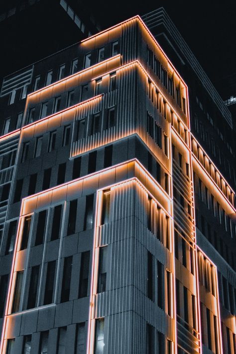 Building Lighting Exterior, Facade Lighting Architecture, Facade Lighting Design, Hotel Lighting Design, Building Lighting, Brown Concrete, Exterior Lighting Design, Hotel Light, Tower Light