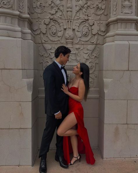 Black Suit Couple Photoshoot, Black Tie Poses, Prom Goals Couples Photo Ideas, Suit And Dress Couple Outfit Elegant, Fancy Couples Photoshoot Poses, Black Suit Black Dress Couple, Prom Pic Couples, Black And Red Couples Outfits, Red Dress Black Suit Couple