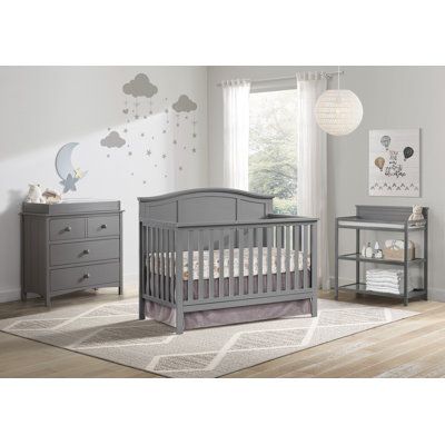 This 4-in-1 Convertible Crib adds style to your nursery with a design that grows with your child. Crib converts to a toddler bed, daybed, and full-size bed (toddler guard rail and full-size conversion kits sold separately). GREENGUARD GOLD CERTIFIED: This 4-in-1 Convertible Crib has achieved GREENGUARD GOLD Certification; GREENGUARD GOLD Certified products have undergone rigorous testing for over 10, 000 chemical emissions, ensuring that this product is certified for low chemical emissions into Grey Crib Nursery, Grey Crib, Wooden Cribs, Baby Cribs Convertible, Guard Rail, Crib Toddler Bed, Nursery Room Inspiration, Grey Nursery, Nursery Crib