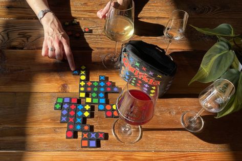 Qwirkle is an excellent travel game for all generations. What Is Play, Pocket Game, Cute Cafe, Travel Games, Deck Of Cards, Different Shapes, When Someone, Travel Essentials, More Fun