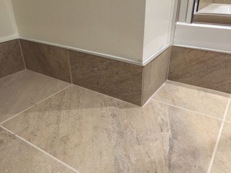 Tiled skirting board with chrome trim Tile Floor Skirting Ideas, Tiled Skirting Boards, No Skirting Boards Ideas, Tile Skirting Ideas, Floor Skirting Ideas, Tiled Skirting, Bathroom Skirting, Tile Skirting, Bathroom Baseboard