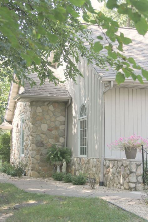 River rock stone accents on our European country inspired cottage exterior. #hellolovelystudio #cottagedesign #houseexterior #rivercottage #riverrock French Courtyard, River Rock Stone, Georgian Revival, Light Grey Paint Colors, White Exterior Paint, Church Conversions, Townhouse Interior, Meditation Garden, Paint Color Inspiration