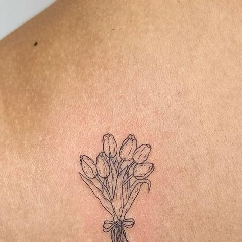 sam- nyc fineline tattoo artist on Instagram: "📍nyc- books are open! dm to book/inquire 🫶🏼dainty, cute, fineline, and pet portrait tattoos  a sweet little custom tulip bouquet for the lovely @kxssvo 💐💐  tysmmm💕  @helloinknyc 🤗  #daintytattoo #floraltattoos #tulip #nyctattoo #finelinetattoos" Dainty Linework Tattoo, Vintage Tulip Tattoo, Small Tulip Bouquet Tattoo, Bunch Of Tulips Tattoo, Vase Of Tulips Tattoo, Mini Bouquet Tattoo, Bouquet Of Tulips Tattoo, Tulip Stamp Tattoo, Dainty Tulip Tattoo