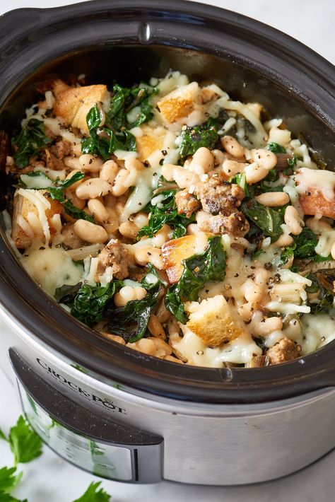 The Best Slow Cooker Recipes for an Office Thanksgiving Potluck Thanksgiving Dinner Recipes Sides, Crockpot Potluck, Thanksgiving Dinner For Two, Bread Stuffing, Thanksgiving Potluck, Sausage Spinach, Swiss Chard Recipes, Beans And Sausage, Slow Cooker Stew