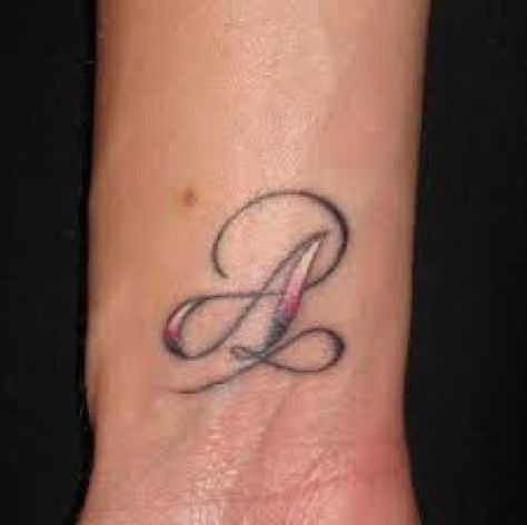 Initial tattoos and lettering tattoos can be designed in a variety of different ways. Initial tattoo designs are worn by both men and women. They usually hold symbolic value to the wearer. Initial tattoos can represent your own initials or the... A Word Tattoo, Wrist Tattoos Words, Diy Tattoo Permanent, Word Tattoo, Wrist Tattoos For Guys, Mini Tattoo, Writing Tattoos, Initial Tattoo, Small Wrist Tattoos