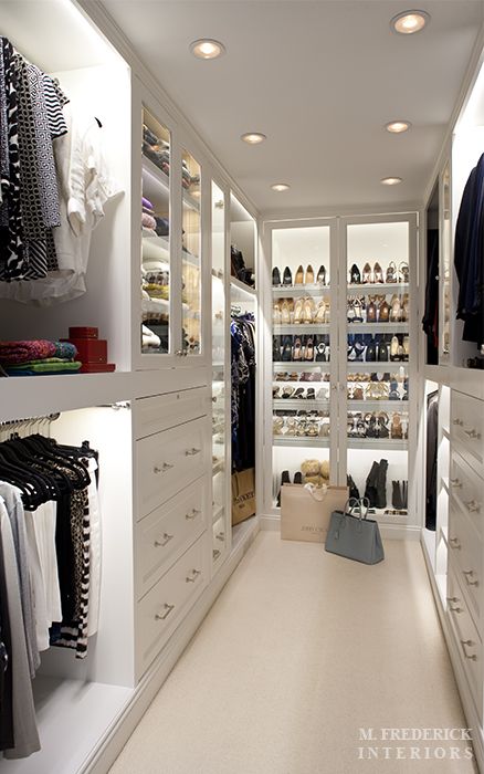 Well-Lit Closet & Glass-Front Cabinet Doors – The soft overhead lighting plus the cabinet lighting makes this closet such a romantic and dreamy space.  The glass front cabinet doors provide dust-free shoe storage while still allowing visibility.   |   Interior Designer: Matthew Frederick   |   Post: "Mendham Road" accessed Jan. 2014 via M. Frederick Interiors (mfrederick.com)   |   Link: http://mfrederick.com/?portfolio=mendham-road Container Store Closet, A Walk In Closet, Koti Diy, Amazing Closets, Walking Closet, Dream Closets, 아파트 인테리어, غرفة ملابس, Closet Goals