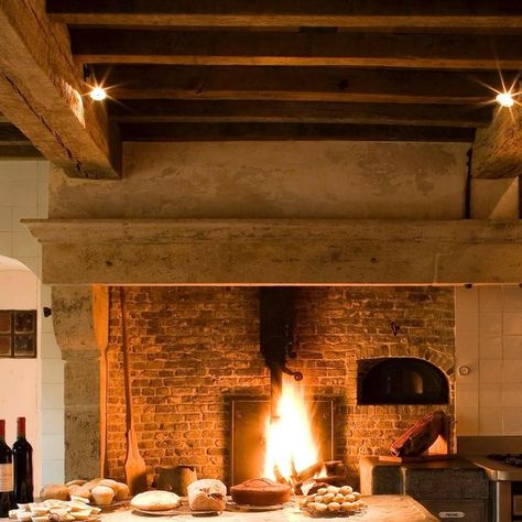 Joris Van Apers Studio on Instagram: "Throwback to a country kitchen. The fire is still burning. 17th-century mantelpiece with a combination of cooking stove, fireplace with grill & integrated bread oven. Kitchen island crafted from recycled drawers with a countertop from an original hunting table. Reclaimed terracotta tiles.  @jopauwelsphotography   #jorisvanapersstudio #interiorarchitecture #architectureinteriors #architectureinterieure #countrylife #countrykitchen #craftsmanship #naturalmaterials #countryliving #reclaimedfurniture #reclaimed #upcycledfurniture #cuisinecampagne #kitchendesign #kitchenrenovation" Oven Kitchen Island, Terracotta Fireplace, Recycled Drawers, Cooking Fireplace, Fireplace Cooking, Oven Kitchen, Fireplace Kitchen, Island Crafts, Bread Oven