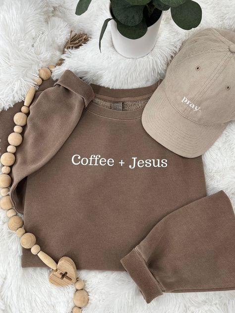 Coffee + Jesus Premium sweatshirt perfect for those chilly mornings and evenings.  Our sweatshirt is great for Christian women and men that love both coffee and Jesus.  Size up for oversize fit.  Coffee Brown Premium Sweatshirt: Female model wearing sweatshirt 5'10" 185 lb 9 oz./yd² (US) 15 oz./L yd (CA), 80/20 cotton/polyester blend with 100% cotton face, 30 singles Standard fit Split stitch double needle sewing on all seams Twill neck tape 1 x 1 ribbing at neck, cuffs and waistband Woven label