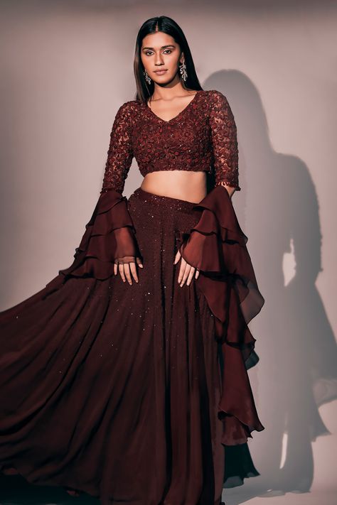 Maroon georgette lehenga with an attached cancan and sequins, thread, cutdana and crystal hand embroidery. Comes with a padded net blouse and a organza ruffled dupatta. Components: 3 Pattern: Hand embroidered Type Of Work: Sequins, Thread, Cutdana, Crystal Neckline: V Neck Sleeve Type: Half Fabric: Lehenga : Georgette, Blouse : Net, Dupatta : Organza, Lining : Shantoon Color: Maroon Other Details:  Attached lining Lehenga length : 44 inches Closure : Side zip Occasion: Destination Wedding - Aza Engagement Lehenga Indian Simple, Lehenga Simple, Sequins Lehenga, Maroon Lehenga, Ruffle Dupatta, Netted Blouse Designs, Long Blouse Designs, My Mistake, Simple Lehenga