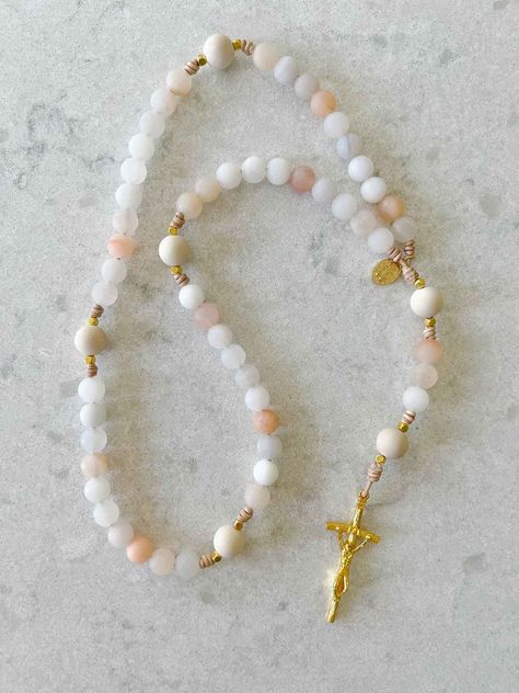 Discover heirloom rosary beads for the Catholic faith, allowing you to pray anywhere. Beautiful beads sure to be treasured for generations. Catholic Candles, The Blessed Mother, Catholic Decor, Peach And Cream, Pearl Rosary, Pale Peach, Candle Inspiration, Rosary Catholic, Rosary Beads